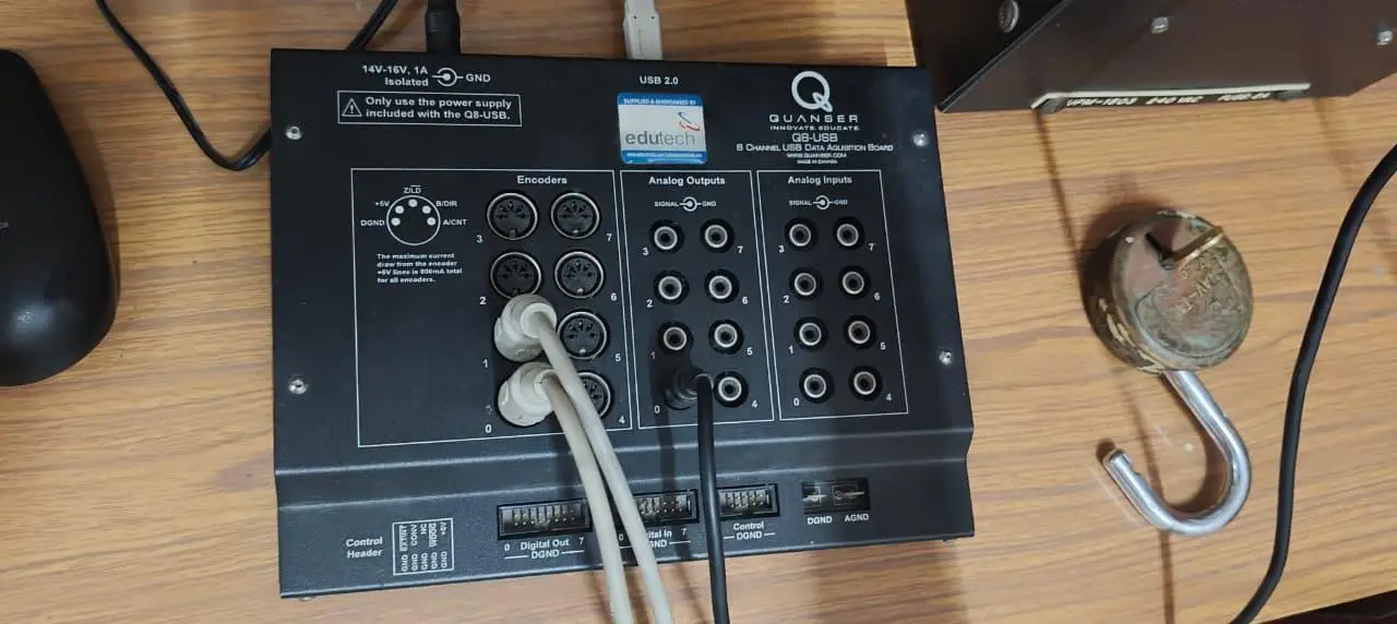Quanser QUARC data-acquisition board wired to the rotary arm hardware.